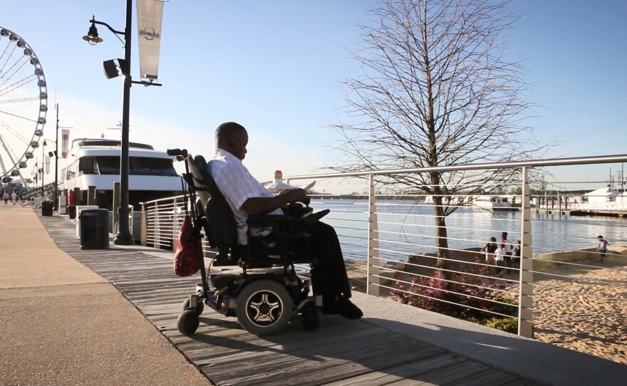 Luther checks out the waterfront near his home in National Harbor, Md.