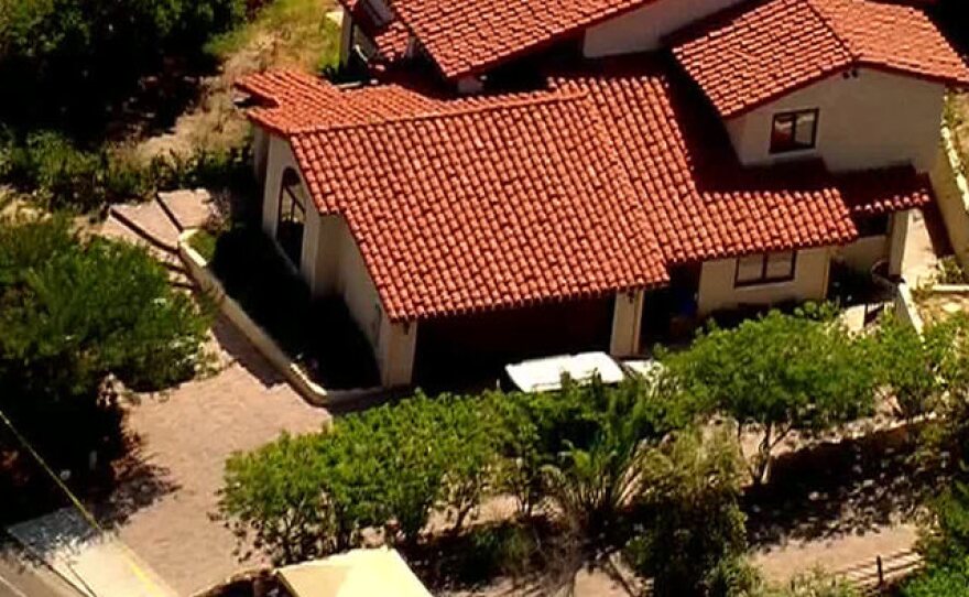 An aerial view shows a Rancho Santa Fe home where sheriff's deputies found the bodies of two women and a teenage girl in a possible double murder-suicide.