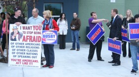 Supporters of Democratic challenger Francine Busby and incumbent Republican Brian Bilbray gather outside Del Norte High School prior to a debate among candidates in the 50th Congressional District. 