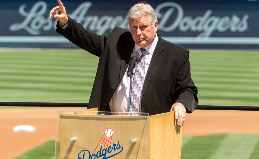 Former Los Angeles Dodgers pitcher Tommy John praises his late friend, Dr. Frank Jobe, during a 2014 memorial service at Dodger Stadium in Los Angeles.