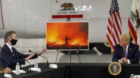 President Donald Trump listens as California Gov. Gavin Newsom speaks during a briefing at Sacramento McClellan Airport, in McClellan Park, Calif., Monday, Sept. 14, 2020, on the western wildfires.