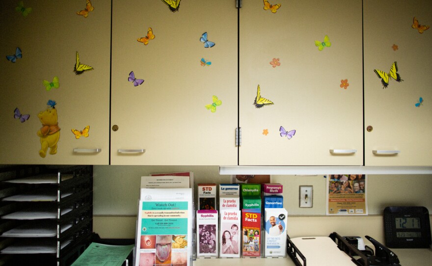 An exam room in the Fresno County Department of Public Health displays info packets about syphilis.