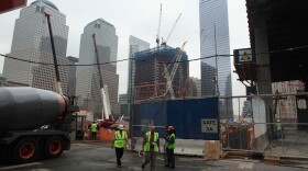 Workers leave Ground Zero, near a proposed site of an Islamic cultural center and mosque in New York, NY. 