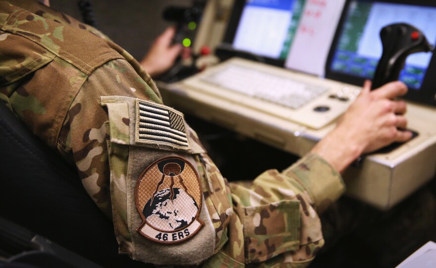 A pilot prepares to launch an unmanned aerial vehicle from a ground control station earlier this year. The Air Force is moving to treat psychological stress faced by remote pilots and analysts a little more like the effects of traditional warfare.