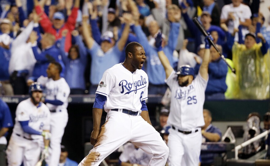 The Royals' Lorenzo Cain celebrates after scoring on a hit by Eric Hosmer in the eighth inning against the Blue Jays in Game 6 of baseball's American League Championship Series.