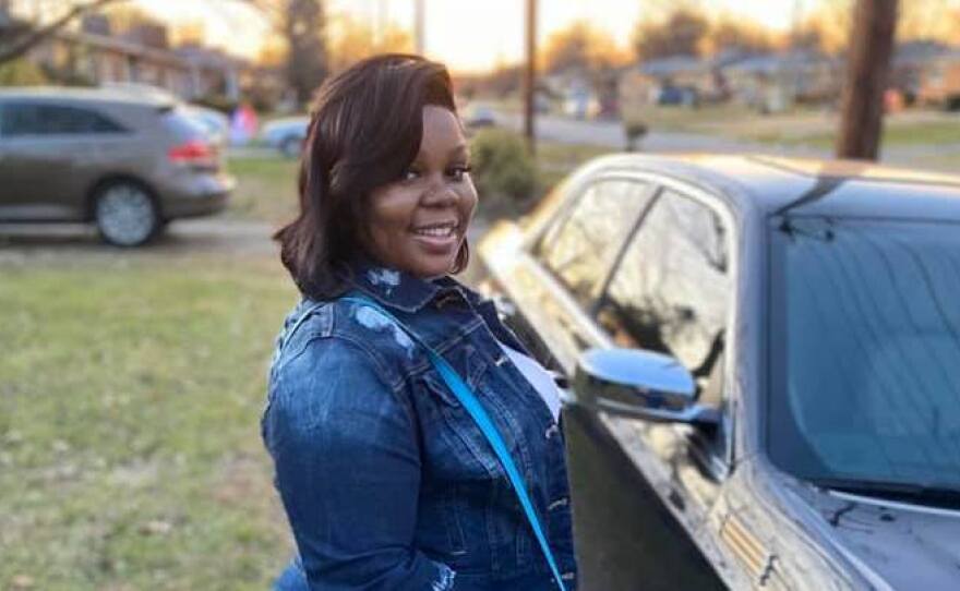 Breonna Taylor poses with her car on Dec. 25, 2019. Her friends and family remember Taylor as a caring person who loved her job in health care and playing cards with her aunts.