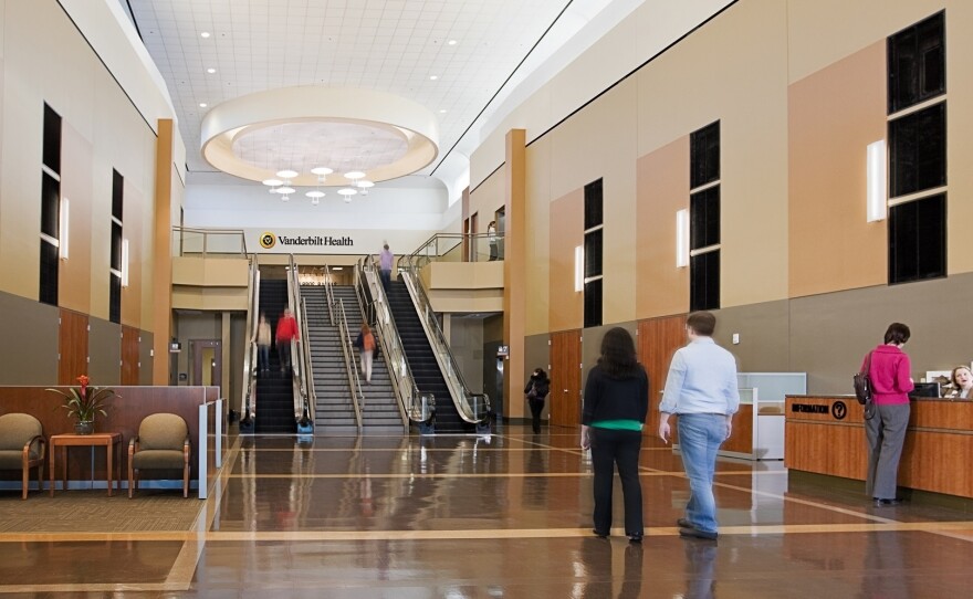 The former main entrance to the One Hundred Oaks Mall (top photo) and the new lobby and reception desk to the Vanderbilt Medical Center in Nashville, Tenn.