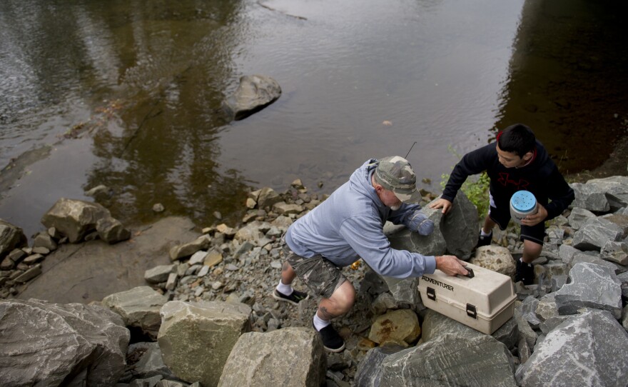 Whedbee fishes for trout with his grandson, Mason, in Two Lick Creek in Homer City, Pa.