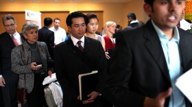 Job seekers wait in line to speak with a job recruiter at the Green Jobs and Entrepeneurship Fair on February 16, 2011 in Berkeley, California.