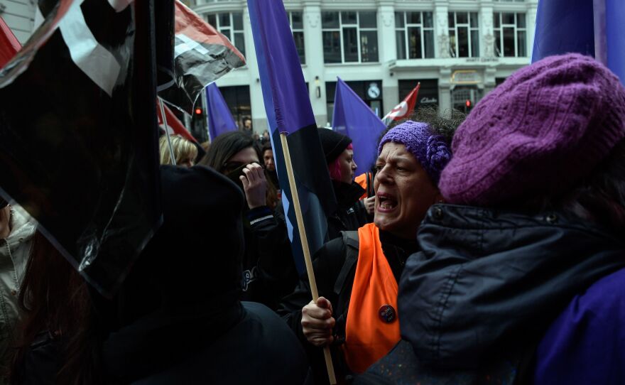 Picketers flooded a clothing store in Madrid during a one-day strike to defend women's rights on Thursday. The walkout called by unions asked women not to spend money and to ditch their domestic chores for the day.