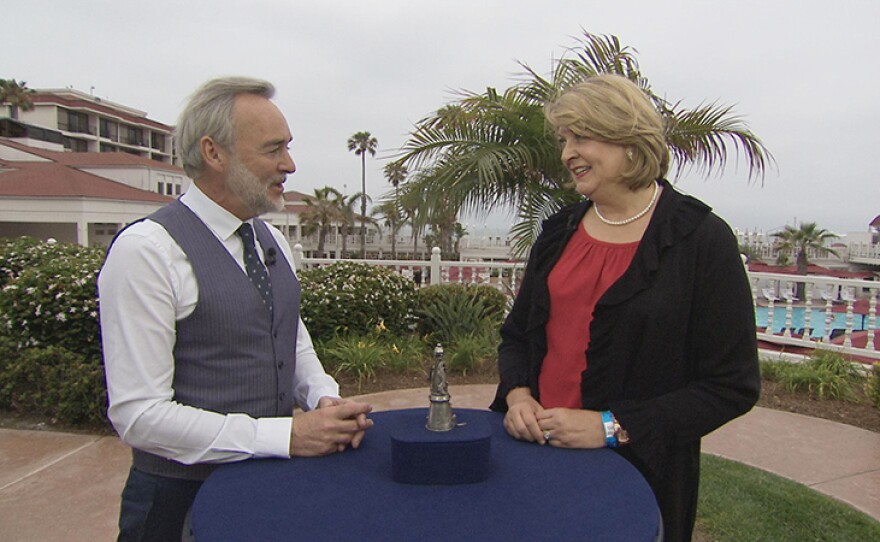 Nick Dawes (left) appraises a Russian silver bouquet holder, ca. 1900, at Hotel del Coronado in Coronado, Calif. ANTIQUES ROADSHOW “Hotel del Coronado, Hour 2” premieres Monday, February 25 at 8/7C p.m. on PBS.