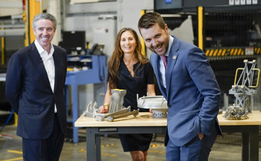 Brian Deese, center, awaits the arrival of President Biden on a May 6, 2022 tour of United Performance Metals in Hamilton, Ohio. Deese was Biden's top economic adviser until February.