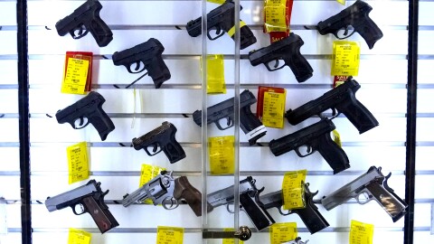 A study estimates that 32 million children live in homes with firearms, and a significant portion of those guns are not stored safely. Here, handguns are displayed at Kittery Trading Post, in Kittery, Maine.