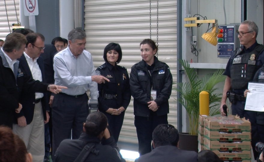 CBP Commissioner Gil Kerlikowske points to first shipment at cargo pre-inspection facility in Tijuana, Jan. 12, 2015.
