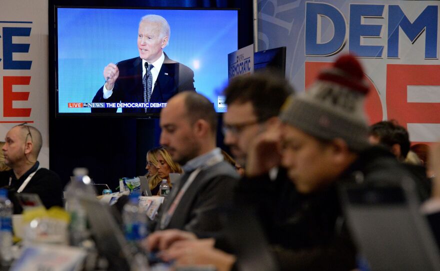 Democratic presidential hopeful former Vice President Joe Biden is seen on a screen in the spin room during debate.