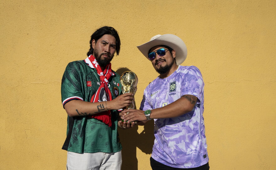 Josh Lee and Fernando Delgado hold a fake trophy outside the Biergarten in Los Angeles' Koreatown before the South Korea vs. Czech Republic World Cup game on June 11.