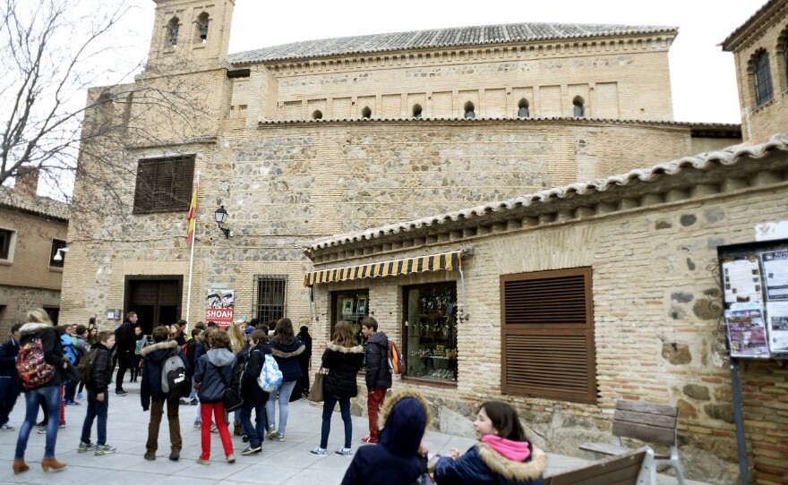 Children gather outside the El Transito synagogue and Sephardic Museum in Toledo, Spain. Founded in 1357, the synagogue was converted into a church following the expulsion of the Jews from Spain in 1492. Spain is now preparing to pass a law that would allow the descendants of the expelled Jews receive Spanish citizenship.