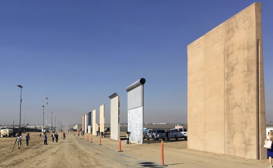 Border wall prototypes on display in San Diego, where contractors offer different designs.