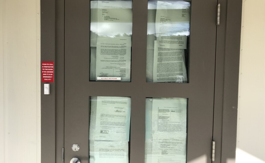 Paper blocks the windows of Julian Fire Station 56, preventing people from seeing inside the building as volunteer firefighters stage a sit-in protest on April 9, 2019