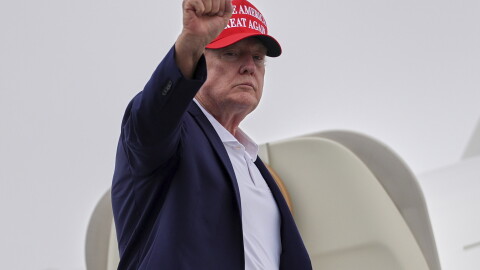 President Donald Trump gestures as he boards Air Force One at Morristown Airport, Sunday, Aug. 16, 2026, in Morristown, N.J.