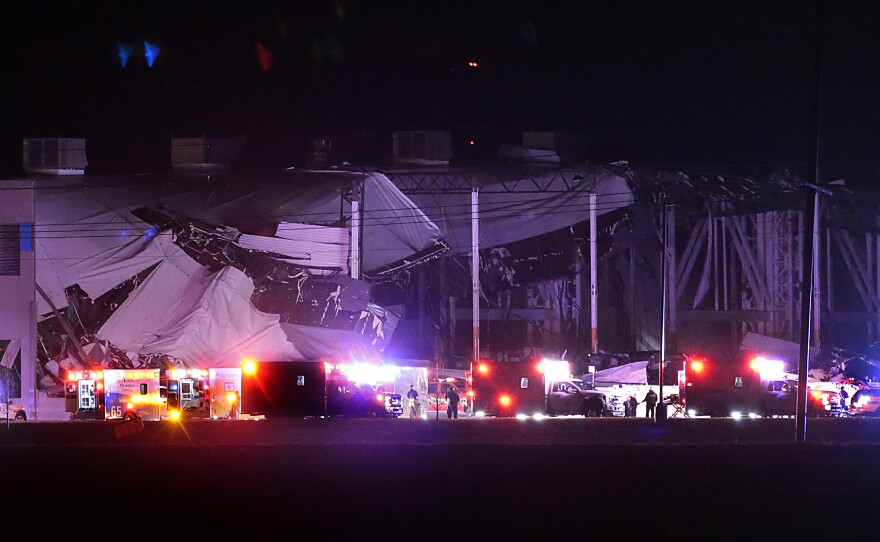The roof of an Amazon distribution center is partially collapsed after being hit by an apparent tornado on Friday, Dec. 10, 2021 in Edwardsville, Ill.