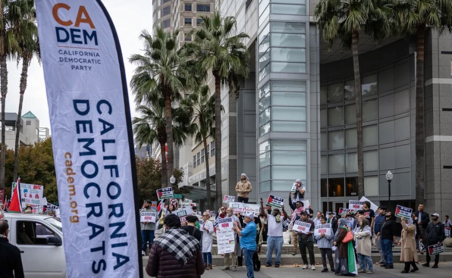 Pro-Palestine protesters arrive at the state Democratic Party Convention event center at the SAFE Credit Union Convention Center in Sacramento on Nov. 17, 2023. Protestors marched through the streets of downtown, calling for a ceasefire in the Israel-Hamas conflict.