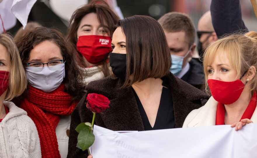 Tikhanovskaya (center, black mask) takes part in a demonstration on the Place des Nations in front of the Palais des Nations in Geneva on March 7.