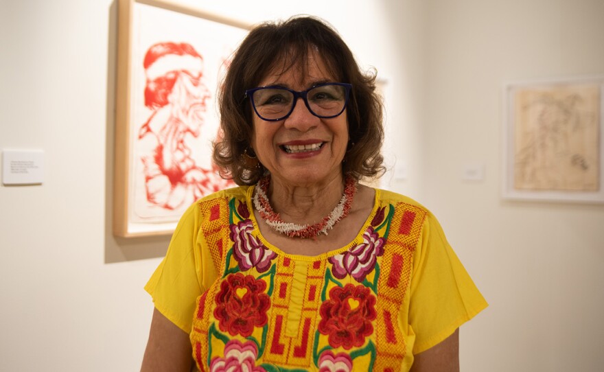 Josie Talamantez, founder of Chicano Park Museum & Cultural Center, stands near an art exhibit by Ramsés Noriega on Oct. 7, 2025.