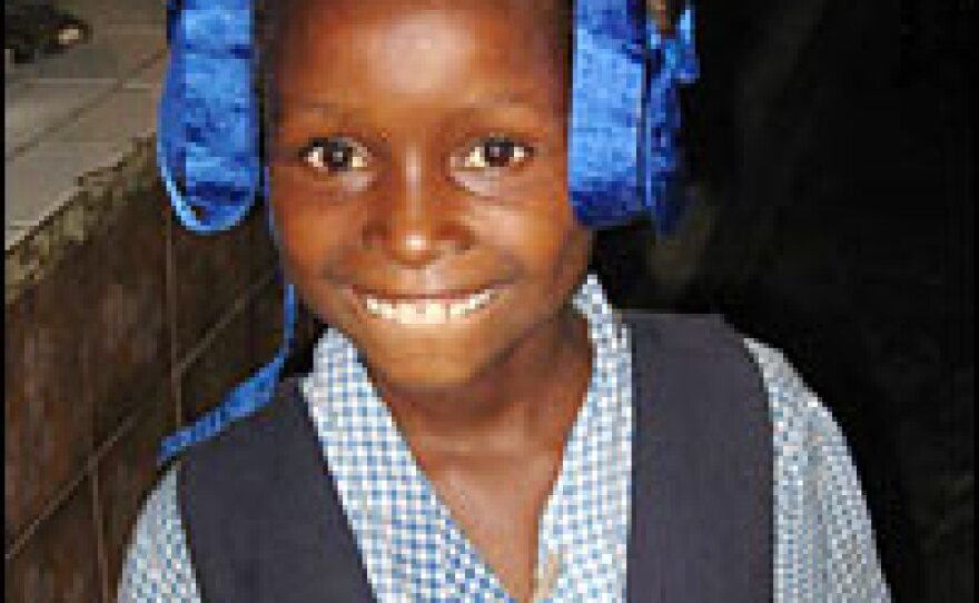 Delia Bonne-Annee, 10, is a student at the St. Vincent de Paul primary school in Cite Soleil. The school serves hot meals that have attracted cash-strapped parents who are desperate to feed their children.