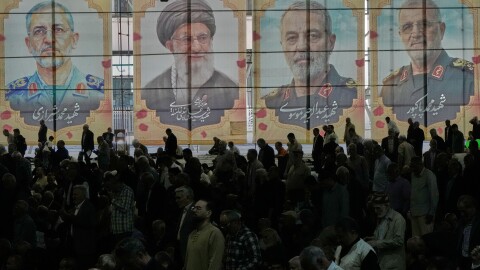 Iranian worshippers perform their Friday prayers under the portraits of the late Iranian Supreme Leader Ayatollah Ali Khamenei, second left, and top military officials who were killed during the U.S.-Israel campaign, at the Tehran University campus, in Tehran, Iran, Friday, April 24, 2026.