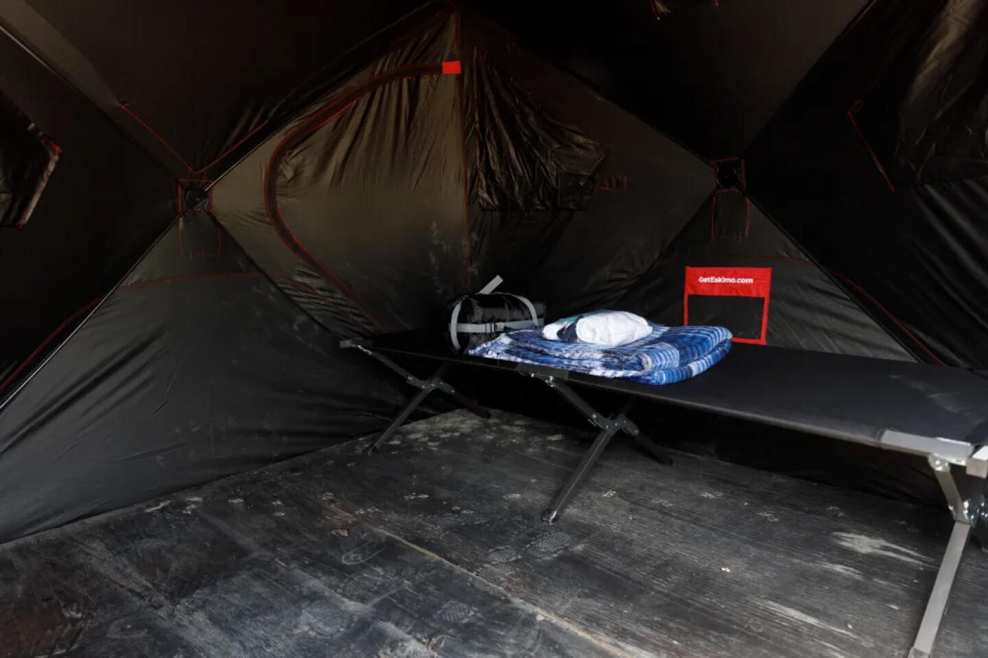 Inside a tent at the O Lot Safe Sleeping site at Balboa Park in San Diego on March 22, 2024. People are given a cot, blanket, sleeping bag, and hygiene kit. The site also offers 24/7 staffing, showers, laundry, and shuttles.
