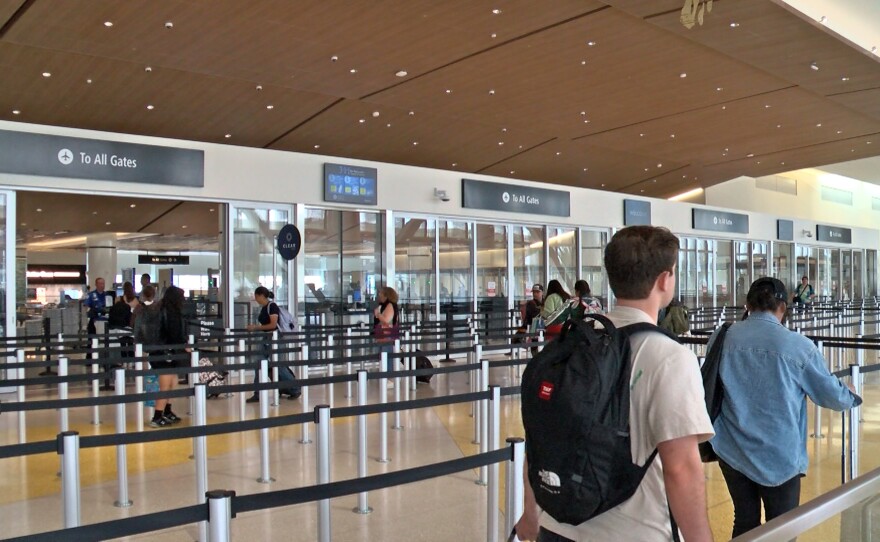 Travelers line up to go through the security checkpoint at San Diego International Airport's Terminal 1 on Oct 21, 2025.
