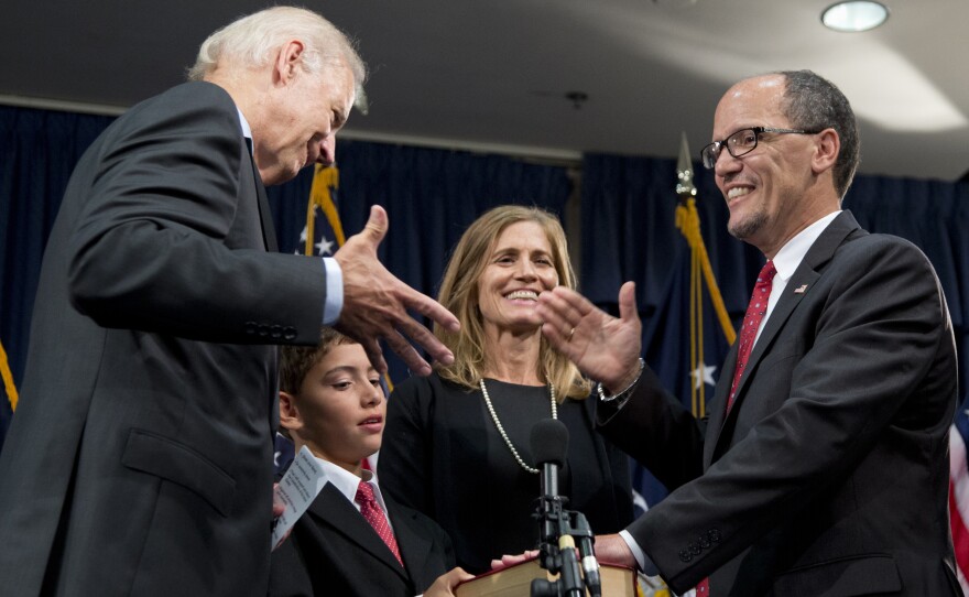 Then-Vice President Biden reaches to shake hands with new Labor Secretary Thomas Perez during a ceremonial swearing-in ceremony for Perez on Sept. 4, 2013.