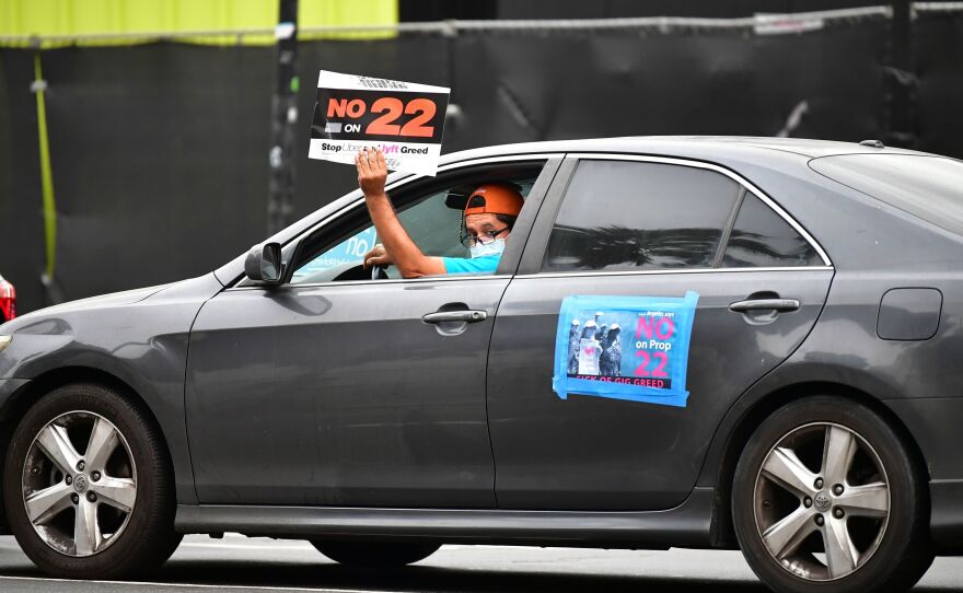 A California ballot measure over whether Uber and Lyft should treat their drivers as employees divided gig workers, but was approved by voters.