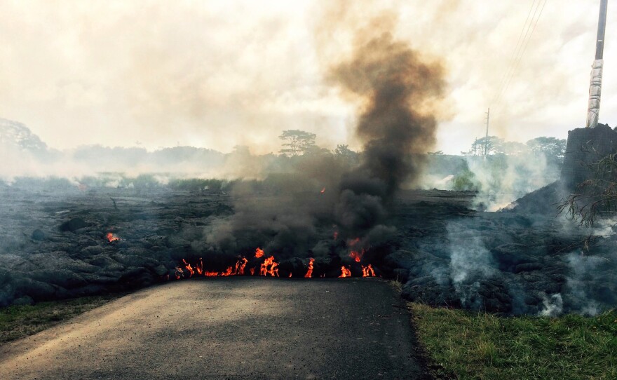 The lava flow from Kilauea Volcano crossed Apa'a Street near Cemetery Road, near the town of Pahoa on the Big Island of Hawaii, on Friday. The flow began June 27; residents in the flow path have now been told to prepare for a possible evacuation.