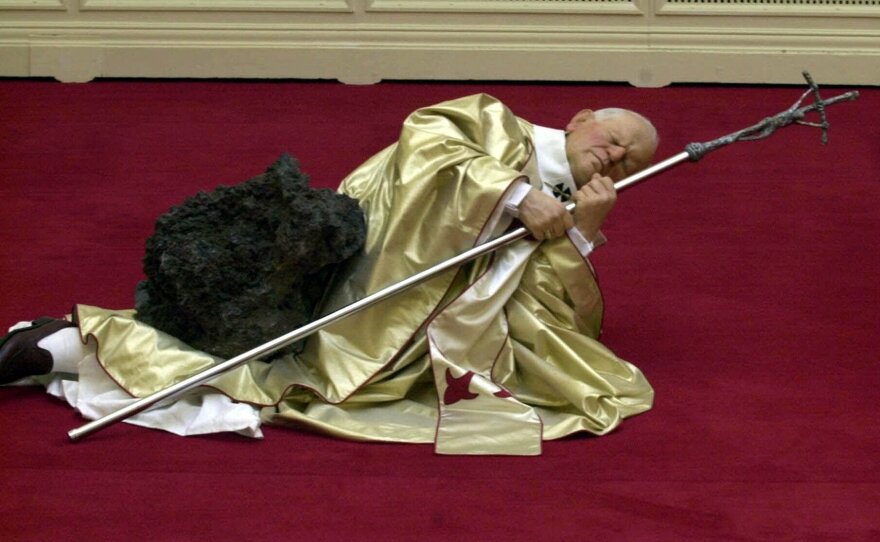 Maurizio Cattelan's waxwork depicting Pope John Paul II after being struck by a meteorite was on display in Sept. 2000 at the Royal Academy in London.