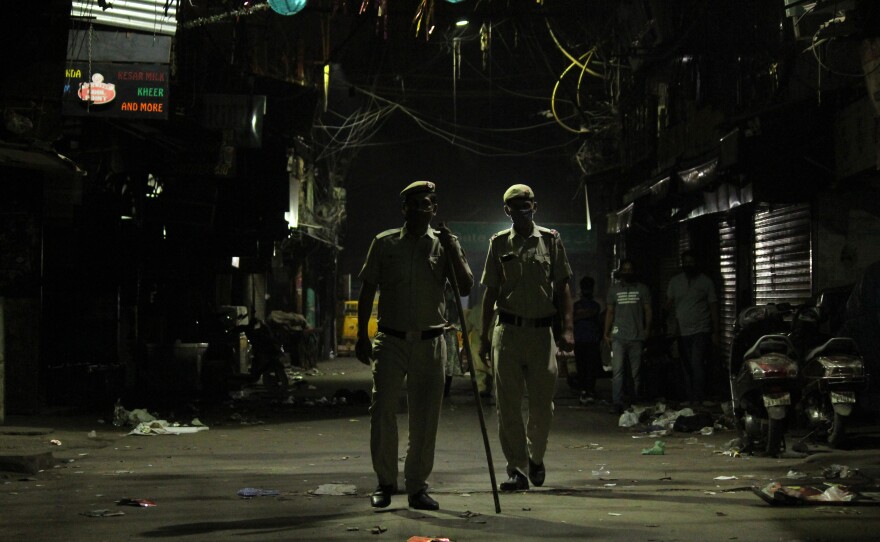 Police officers stand guard during a night curfew designed to limit the spread of the coronavirus in New Delhi April 6, 2021. The national capital imposed a 10 pm to 5 am curfew until April 30.