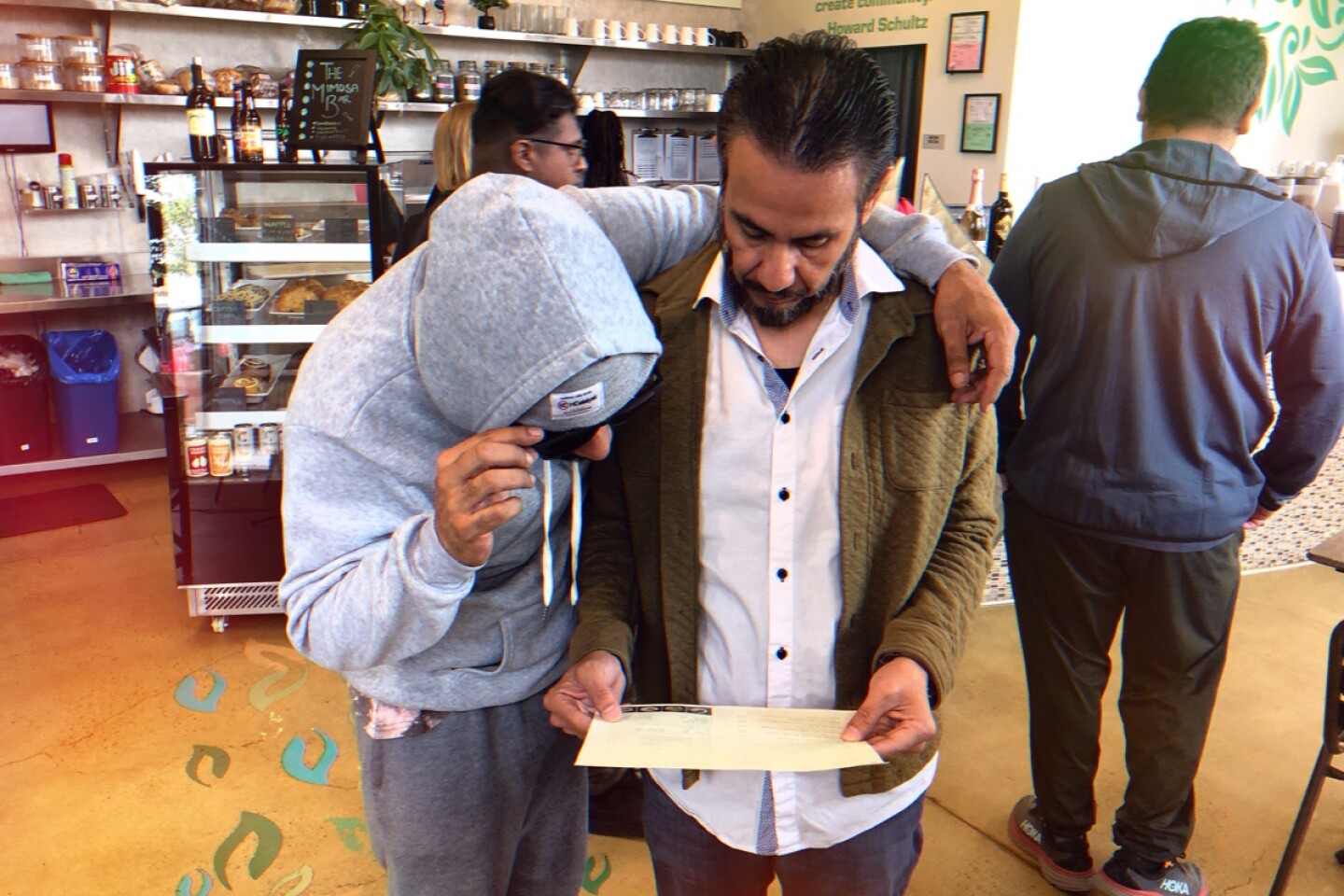 Co-host and head editor Chris Reyes with project manager Eddie Rangel at the Mental Bar on Imperial Ave