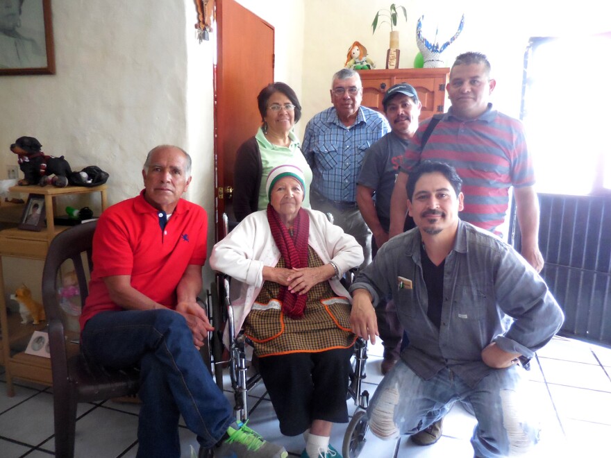 Casimira Navarro Lopez (center), whose soon-to-be-fiancé, Luis Miranda Cuevas, was killed in the 1948 plane crash, poses for a photo with family members and author Tim Z. Hernandez (right) at her home in Jocotepec, Jalisco in 2015.