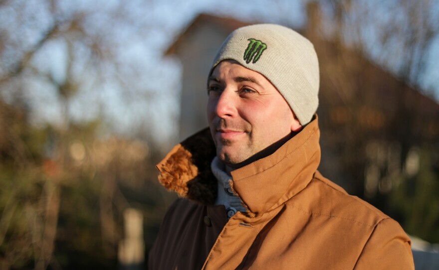 Bohdan Khrystina helps maintain a checkpoint on a road outside the city of Lviv in western Ukraine, hundreds of miles from the battles raging to the east.