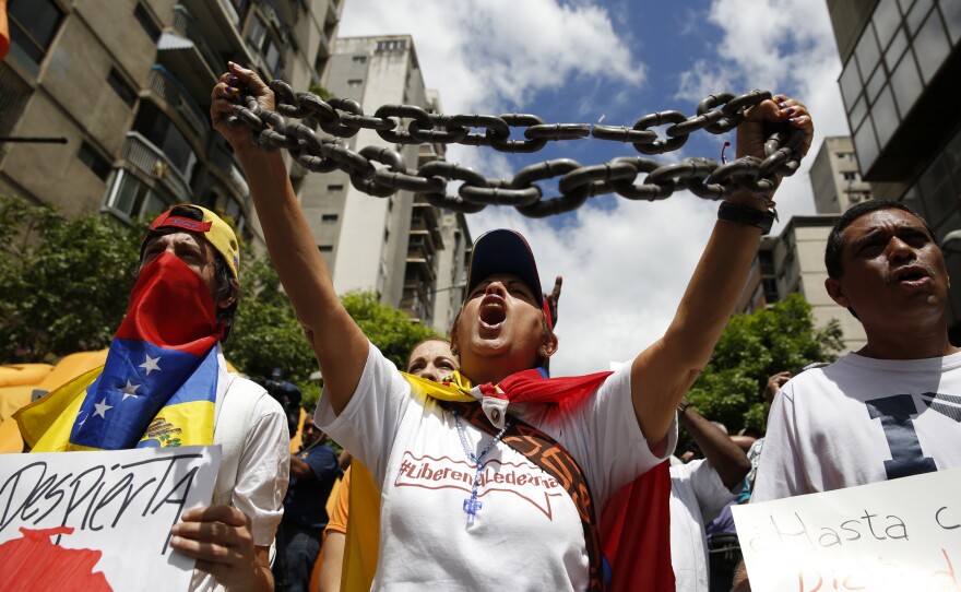 Opposition supporters in Caracas protest against the Venezuelan government and in support of jailed opposition leaders Leopoldo Lopez and Antonio Ledezma on Feb. 28.