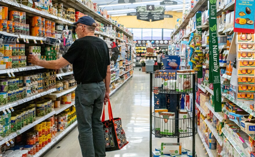 A customer shops in a grocery store on July 15 in Houston, Texas. The drop in gas prices in parts of the country could bring some relief to the inflation rate, although consumer prices still remain high.