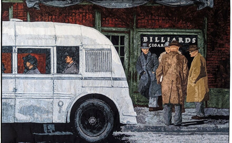 "Mill Town Bus Stop" is a quilt by Maggie Dillon on view at Visions Museum of Textile Arts.
