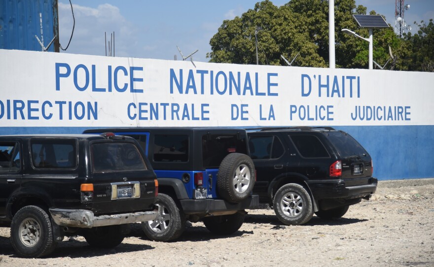 Five Americans and several other men were arrested after police discovered they were carrying a number of automatic rifles and pistols in Port-au-Prince. The men are being held at this Haitian National Police compound.