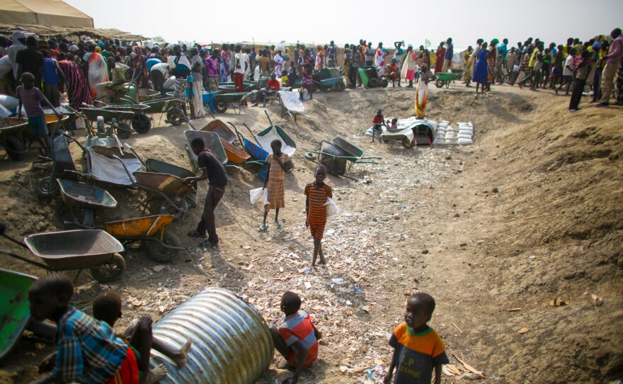 When the monthly food rations are distributed to residents, kids will transport the heavy sacks of sorghum and split peas in exchange for food or money.
