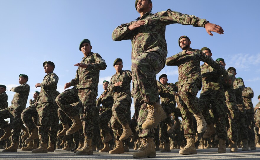 Newly graduated Afghan National Army personnel march during their graduation ceremony in November 2020. U.N. Secretary-General Antonio Guterres said in a report obtained by The Associated Press that more than 100 former members of the Afghan government, its security forces and those who worked with international troops have been killed since the Taliban takeover of the country.