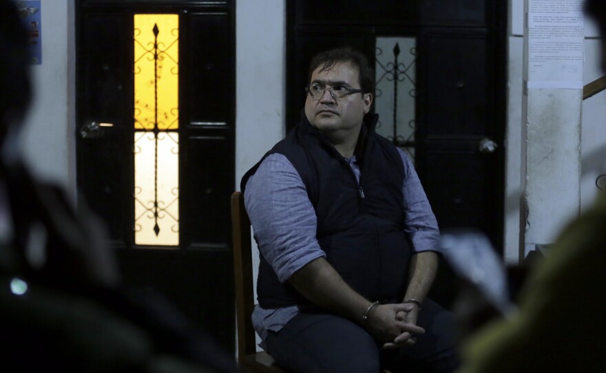 Javier Duarte, the former governor of the Mexican state of Veracruz, sits handcuffed following his arrest in Panajache, Guatemala, on Saturday.