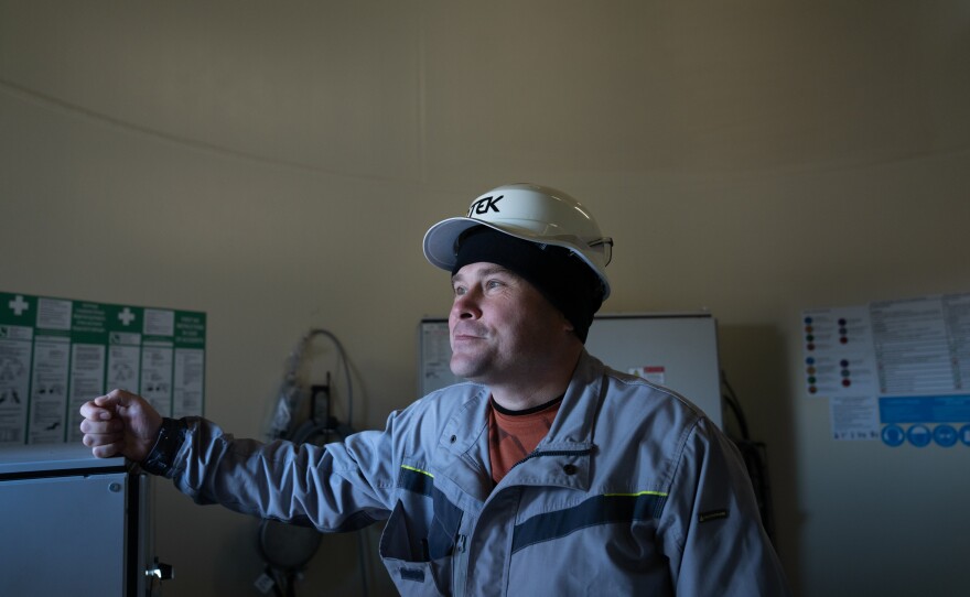 Maksym Bogadytsya, the chief power engineer at the Tylihulska Wind Power Station, stands inside one of the wind turbines in the Mykolaiv region.
