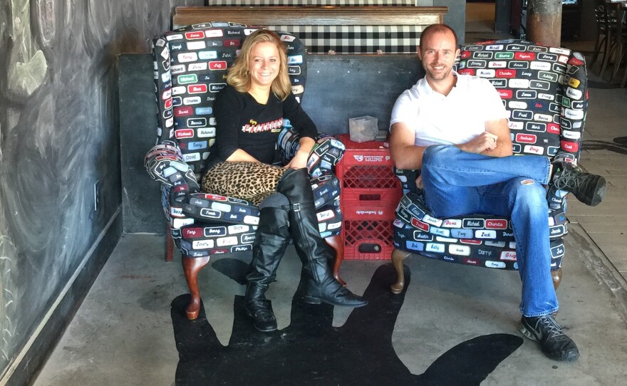 Kurt Stephens (right) is general manager of Packhouse, a restaurant in Newport, Ky., that has eliminated tips in favor of a higher hourly rate for its servers, including Jessica Krebs, pictured here.