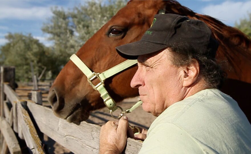 Dan Gallagher on his farm in Charlo, Mont., with his horse, Angel.